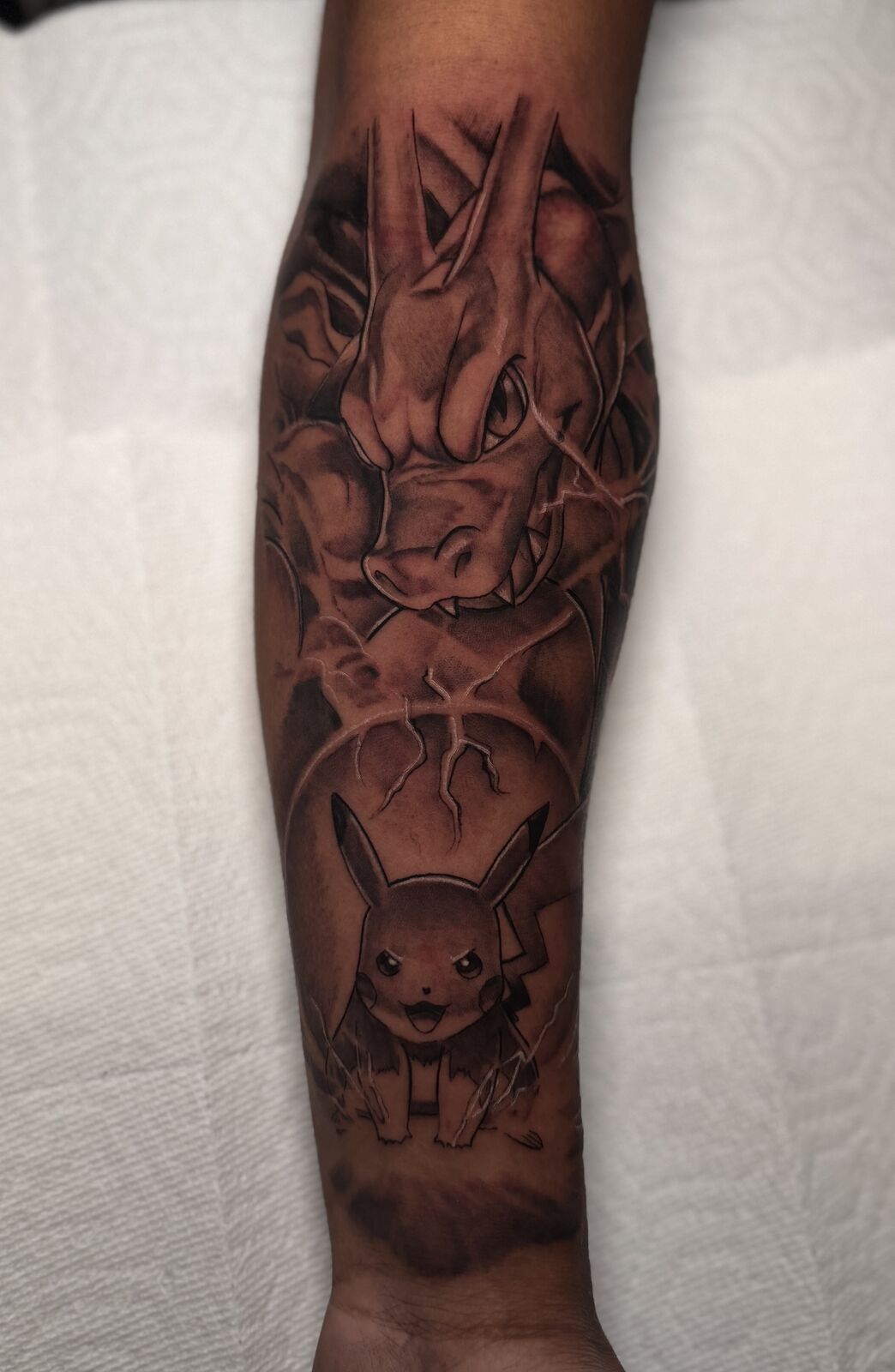 Forearm piece with hands and a character